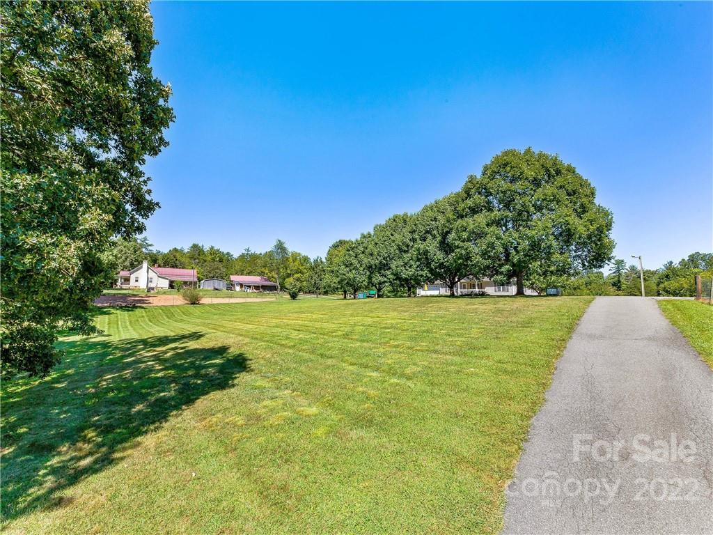 4411 Eller Ford Road Weaverville, NC 28787 - Photo 3 of 20 a view of a lake with a yard