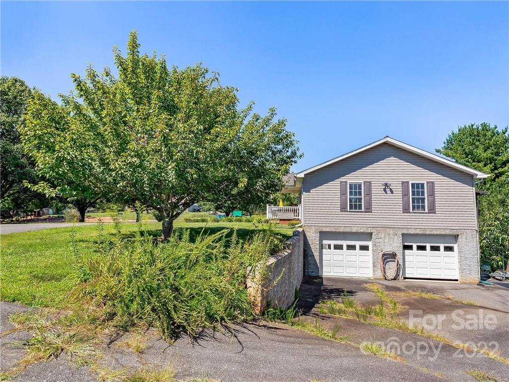 4411 Eller Ford Road Weaverville, NC 28787 - Photo 5 of 20 a view of a house with a yard