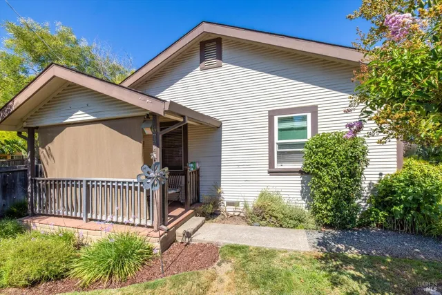a view of a house with wooden fence