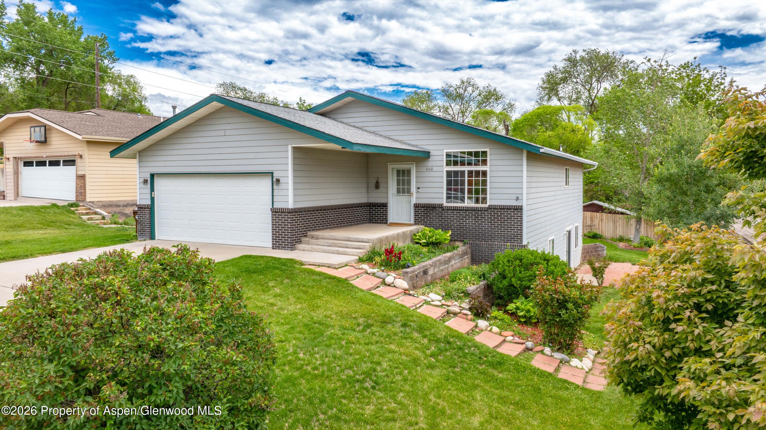 660 Aspen Avenue Rifle, CO 81650 - Photo 1 of 30 a backyard of a house with green space