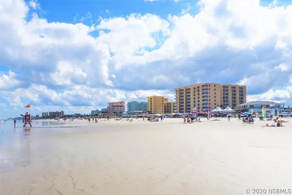 a view of a swimming pool and lounge chair