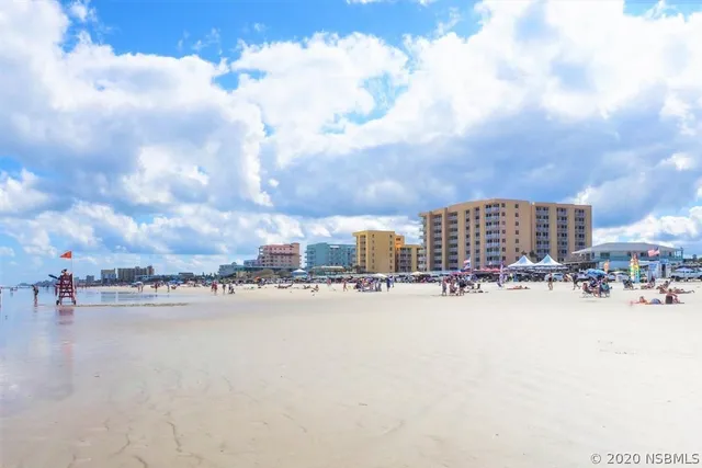 a view of a swimming pool and lounge chair