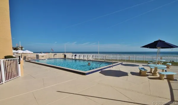 a view of a terrace with wooden floor and lake view