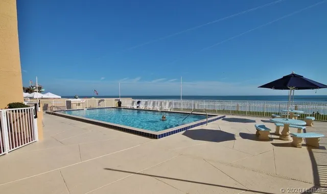 a view of a terrace with wooden floor and lake view