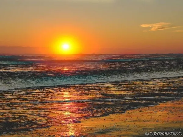 a view of balcony with wooden floor and fence