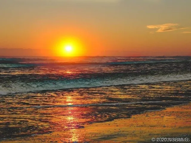 a view of balcony with wooden floor and fence