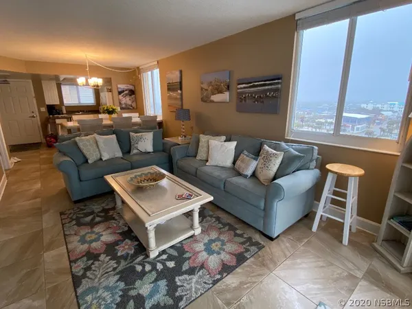 a living room with furniture and a rug