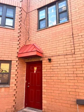 a front view of a building with windows