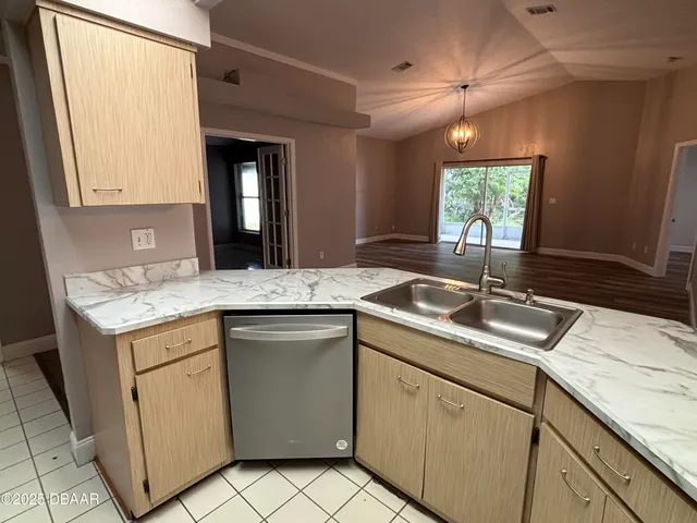 a kitchen with a sink and a window