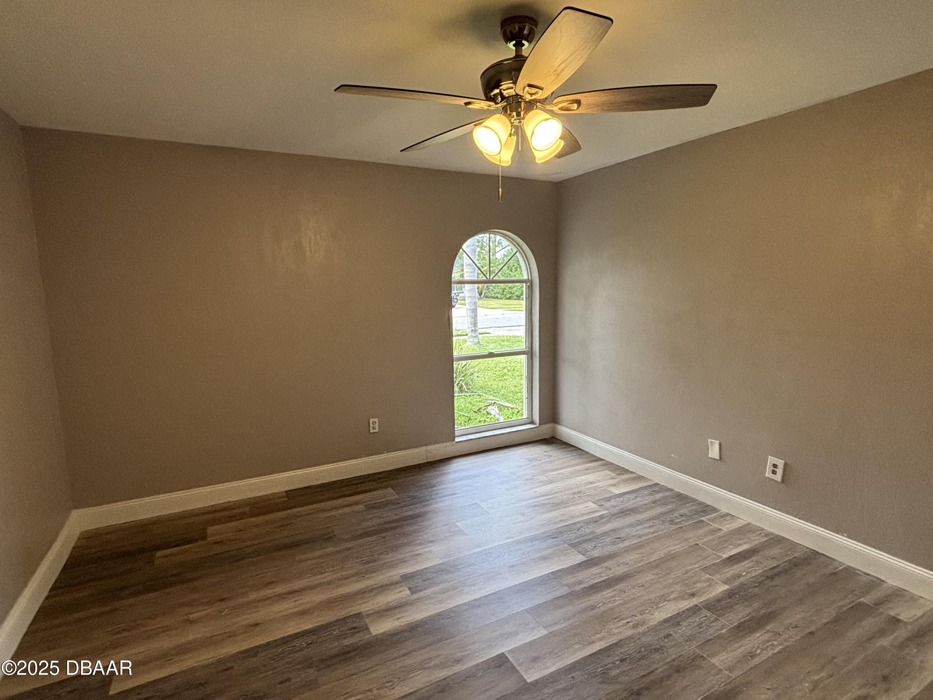 5426 Landis Avenue Port Orange, FL 32127 - Photo 12 of 30 wooden floor in an empty room with a window