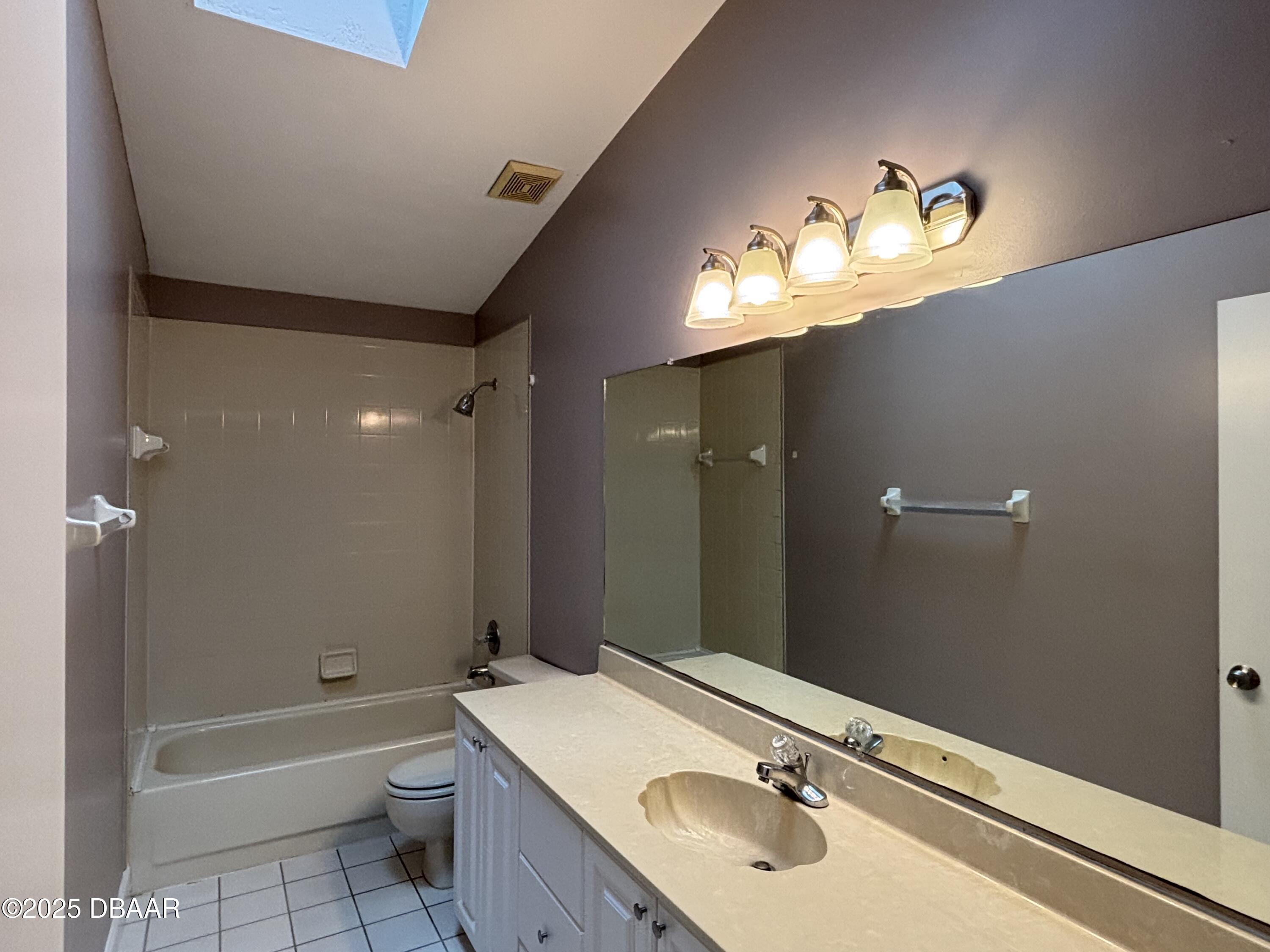 5426 Landis Avenue Port Orange, FL 32127 - Photo 14 of 30 a bathroom with a sink and a mirror
