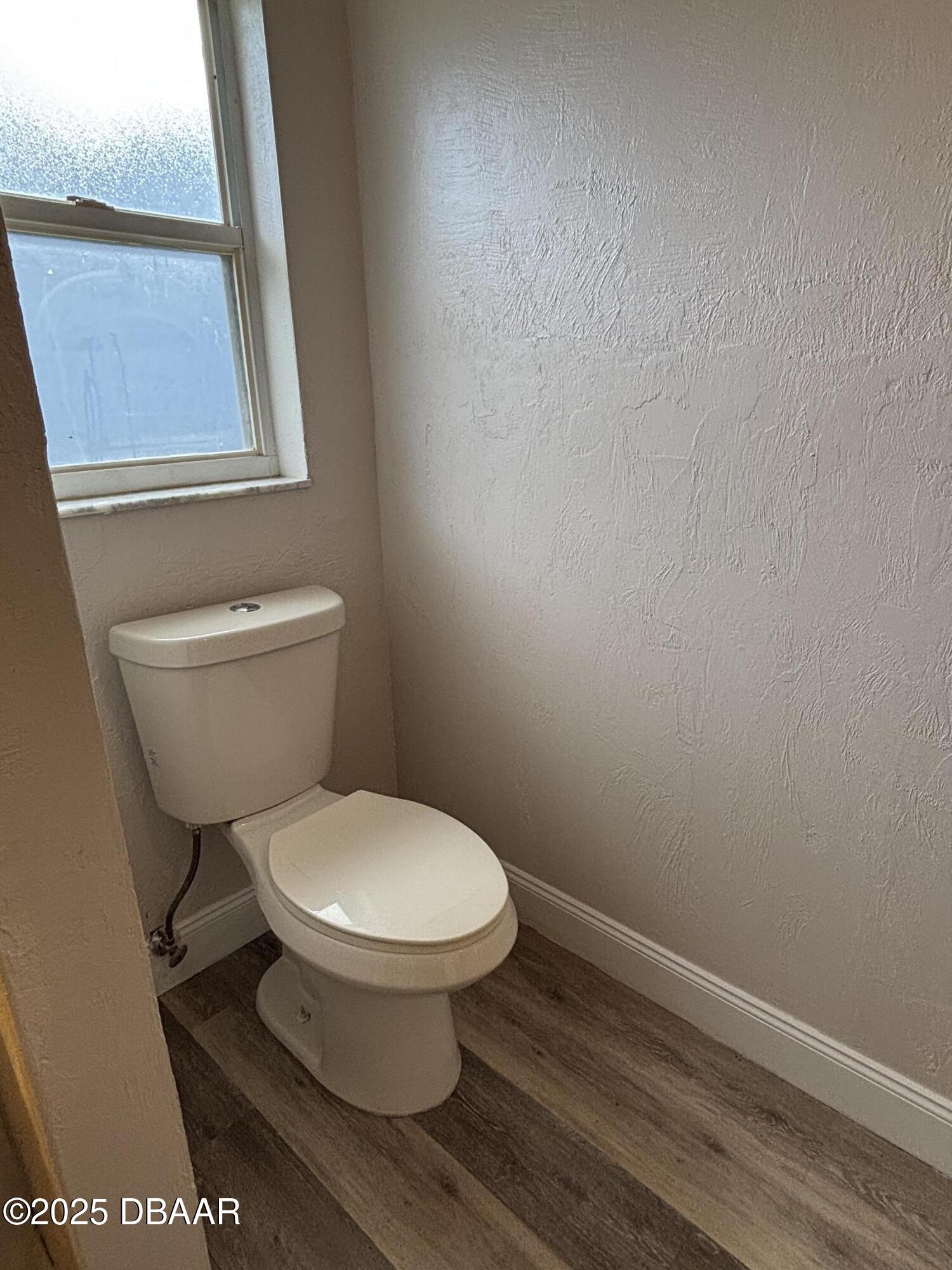 5426 Landis Avenue Port Orange, FL 32127 - Photo 21 of 30 a white toilet sitting next to a window