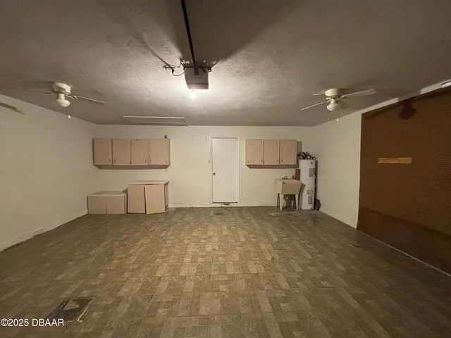 an empty room with a empty space and windows