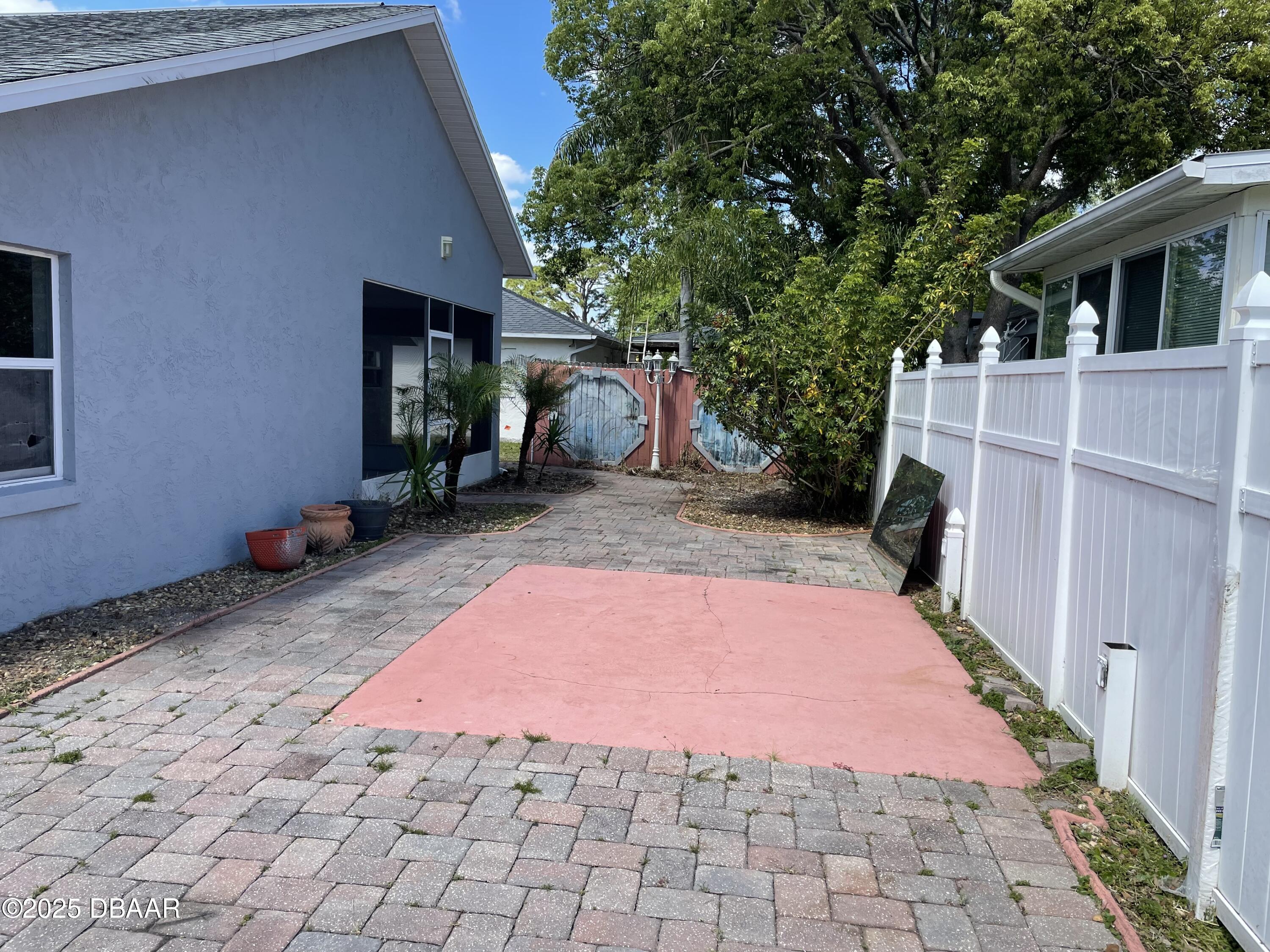 5426 Landis Avenue Port Orange, FL 32127 - Photo 28 of 30 a backyard of a house with yard and furniture