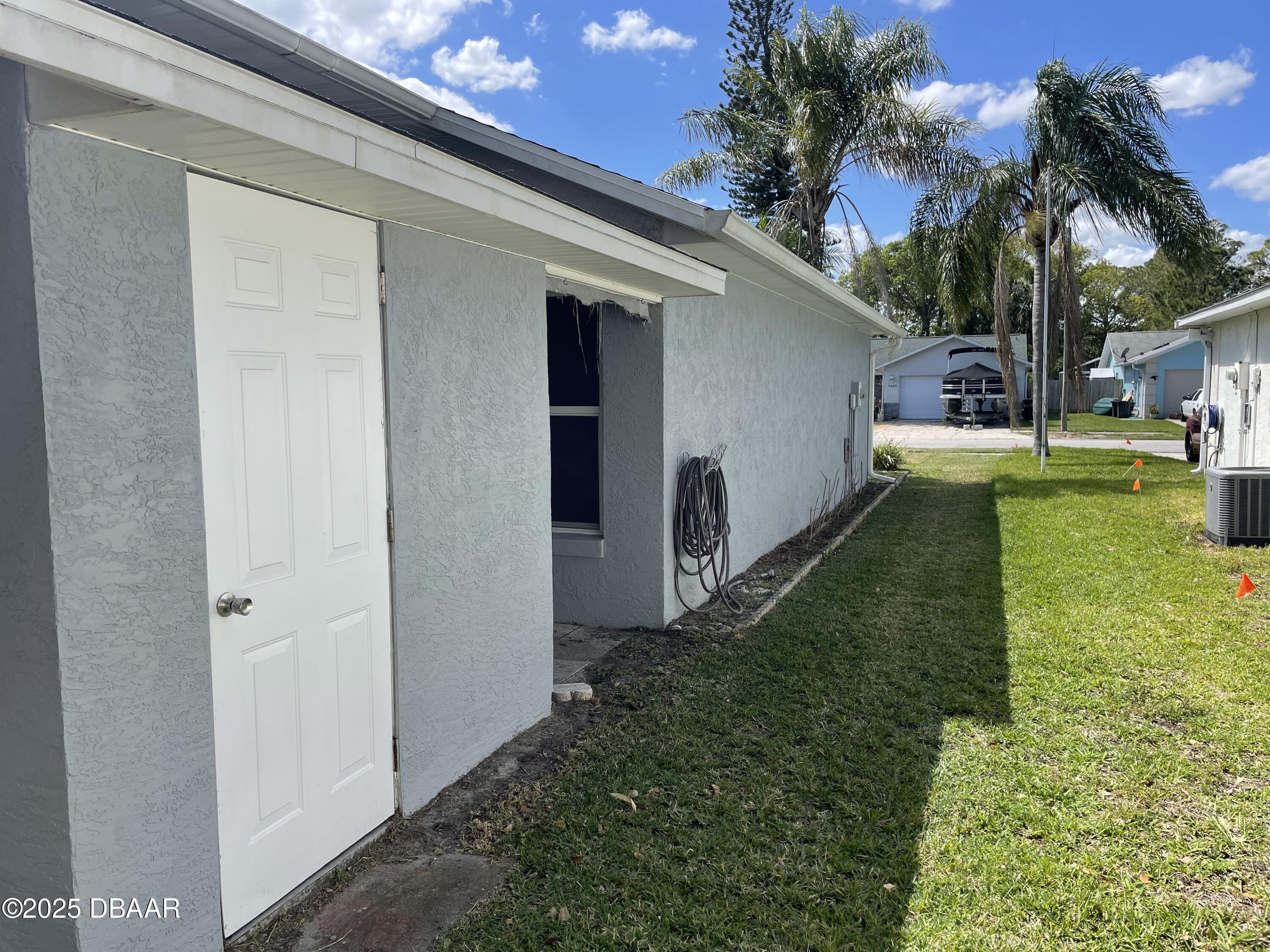 5426 Landis Avenue Port Orange, FL 32127 - Photo 29 of 30 a view of a house with a backyard