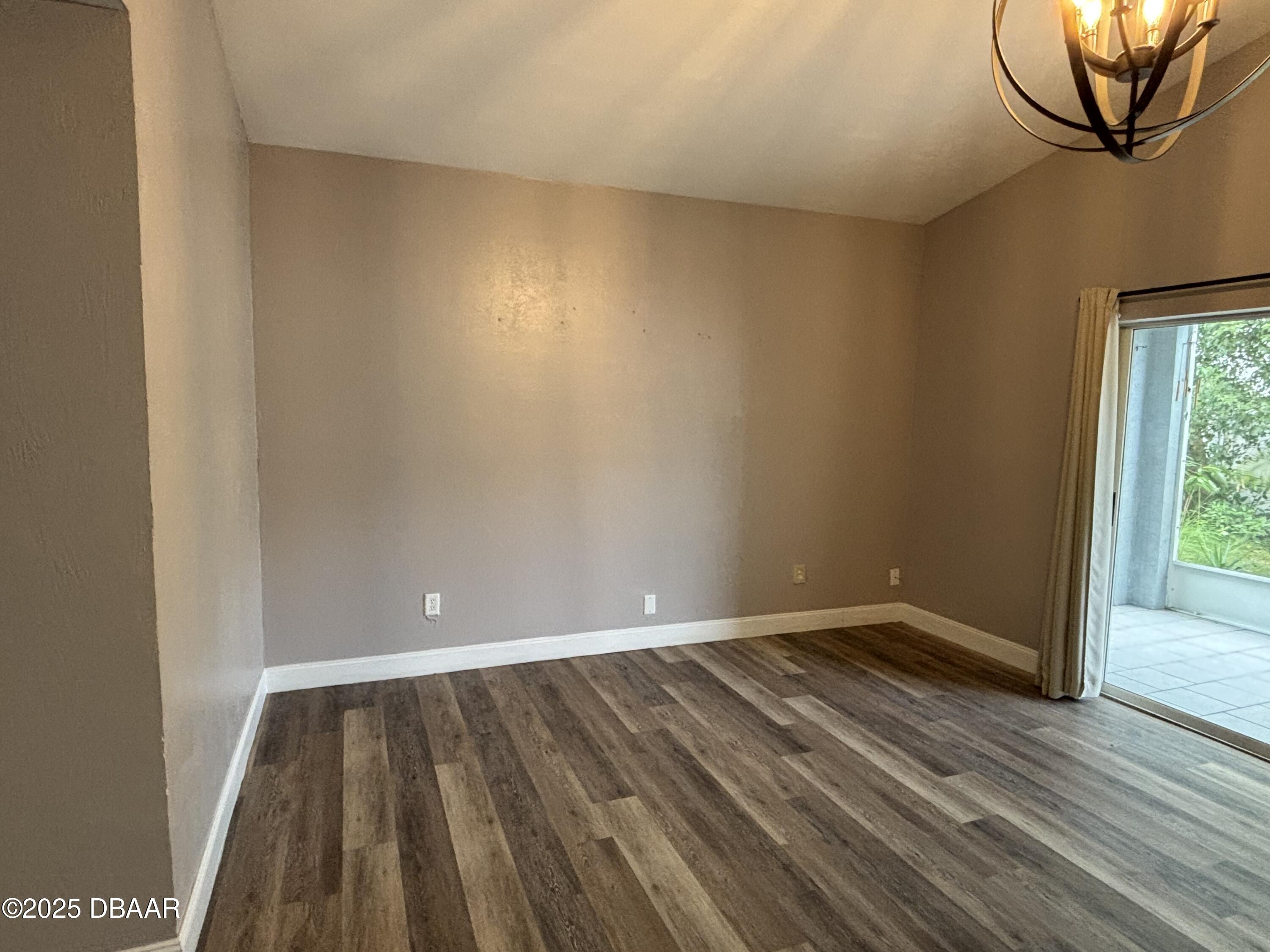 5426 Landis Avenue Port Orange, FL 32127 - Photo 4 of 30 a view of room with window and wooden floor