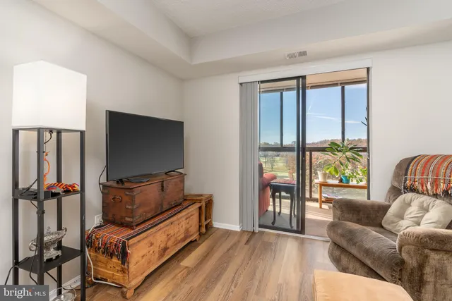 a bathroom with a sink a toilet a mirror and shower
