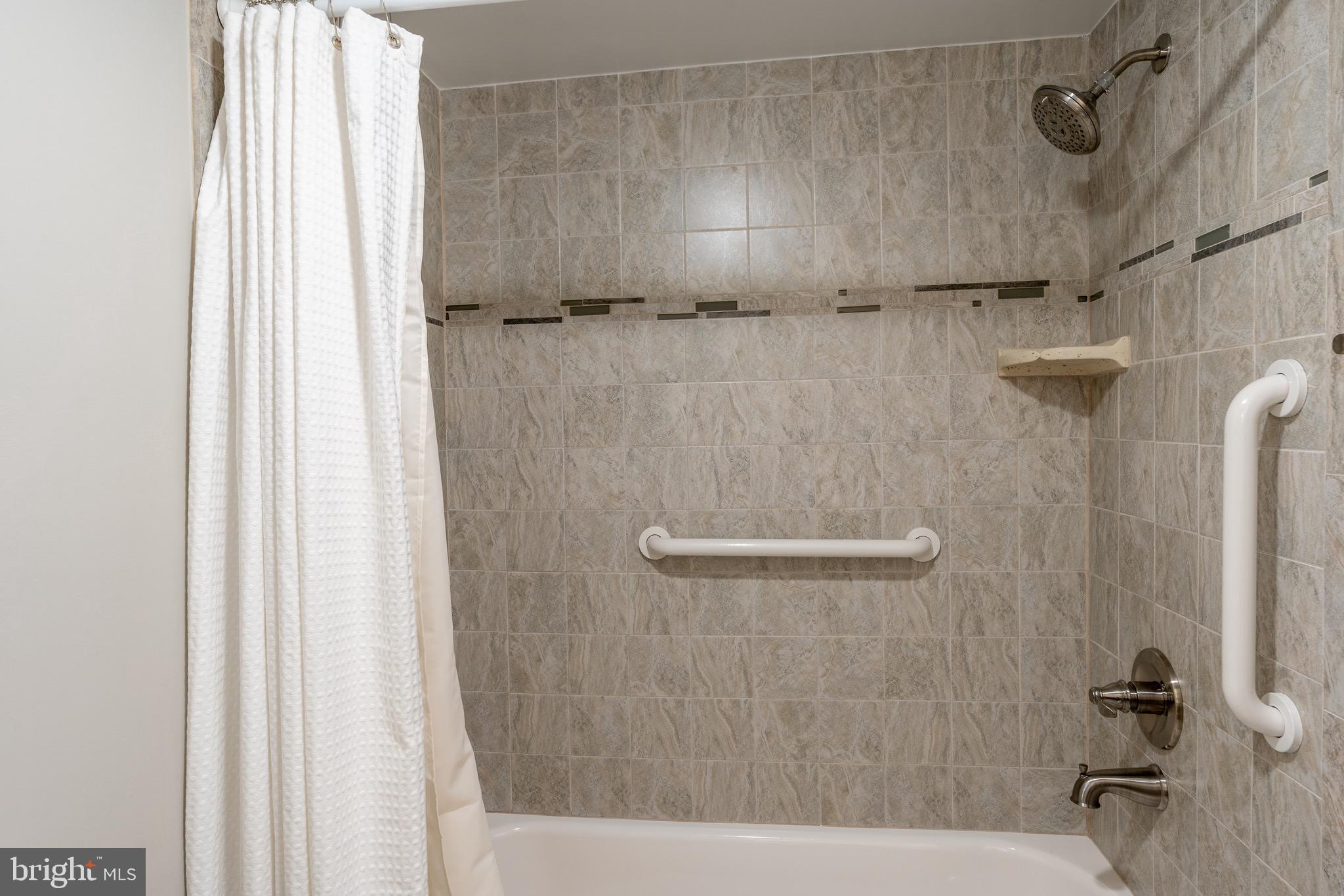 15101 Interlachen Drive, Unit 1612 Silver Spring, MD 20906 - Photo 29 of 37 Sleek tiled shower