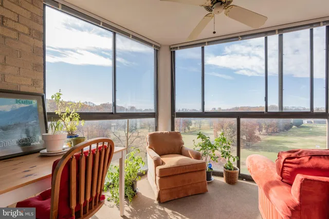 a living room with large windows