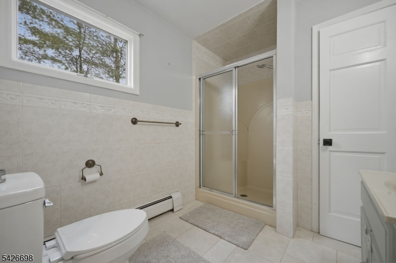 30 Eatontown Road West Milford, NJ 07421 - Photo 19 of 50 a bathroom with a toilet and shower