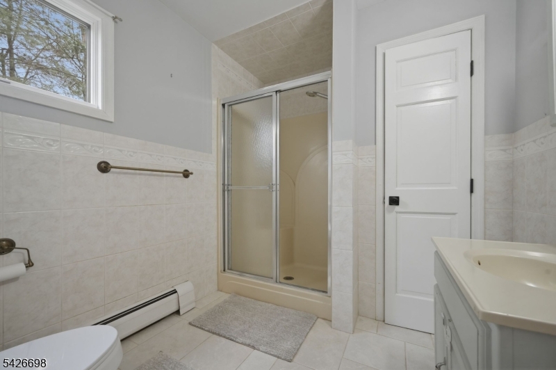 30 Eatontown Road West Milford, NJ 07421 - Photo 20 of 50 a bathroom with a shower and a sink