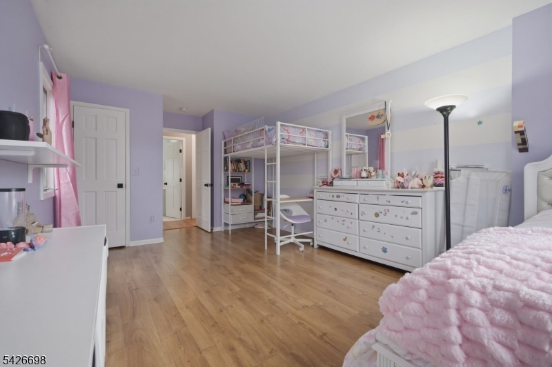 30 Eatontown Road West Milford, NJ 07421 - Photo 21 of 50 a bed room with a bed and a cabinets