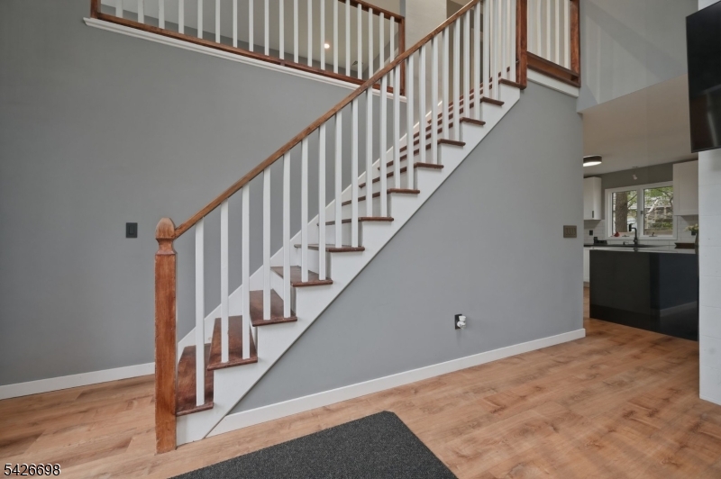 30 Eatontown Road West Milford, NJ 07421 - Photo 24 of 50 a view of staircase with wooden floor and white walls