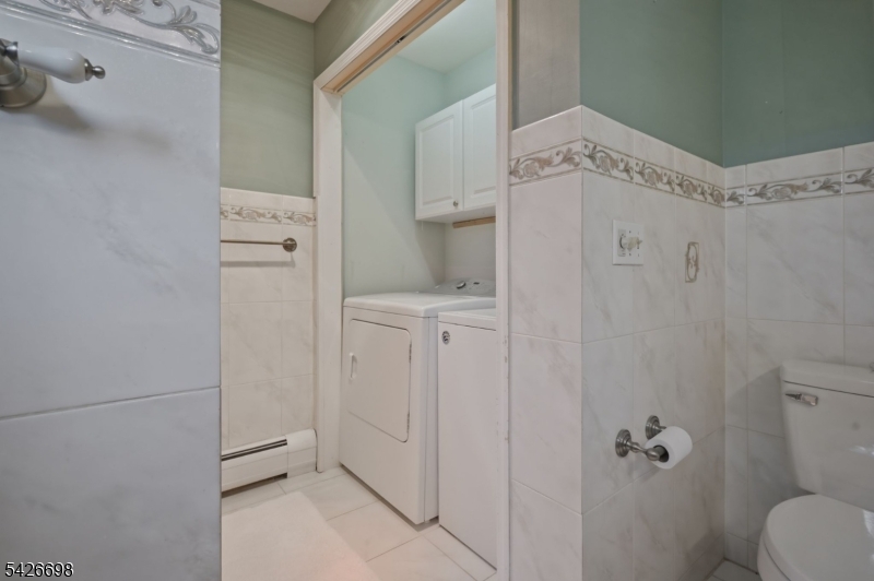 30 Eatontown Road West Milford, NJ 07421 - Photo 33 of 50 a bathroom with a sink a toilet and shower