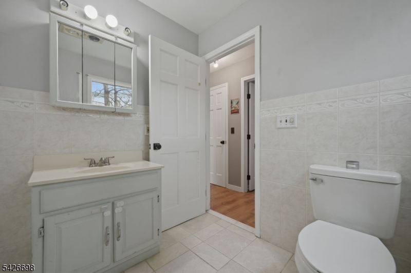 30 Eatontown Road West Milford, NJ 07421 - Photo 36 of 50 a bathroom with a toilet a sink and shower