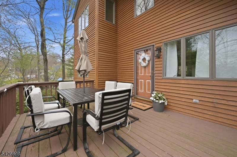 30 Eatontown Road West Milford, NJ 07421 - Photo 39 of 50 a front view of a house with garden and seating area