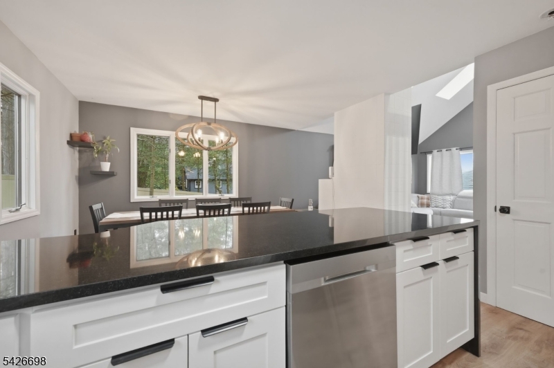 30 Eatontown Road West Milford, NJ 07421 - Photo 10 of 50 a kitchen with granite countertop a sink a stove and cabinets