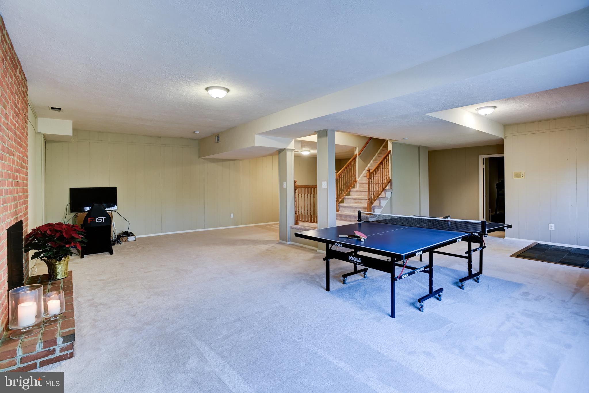 13629 Esworthy Road Germantown, MD 20874 - Photo 45 of 50 Large lower level recreation area with wood FP