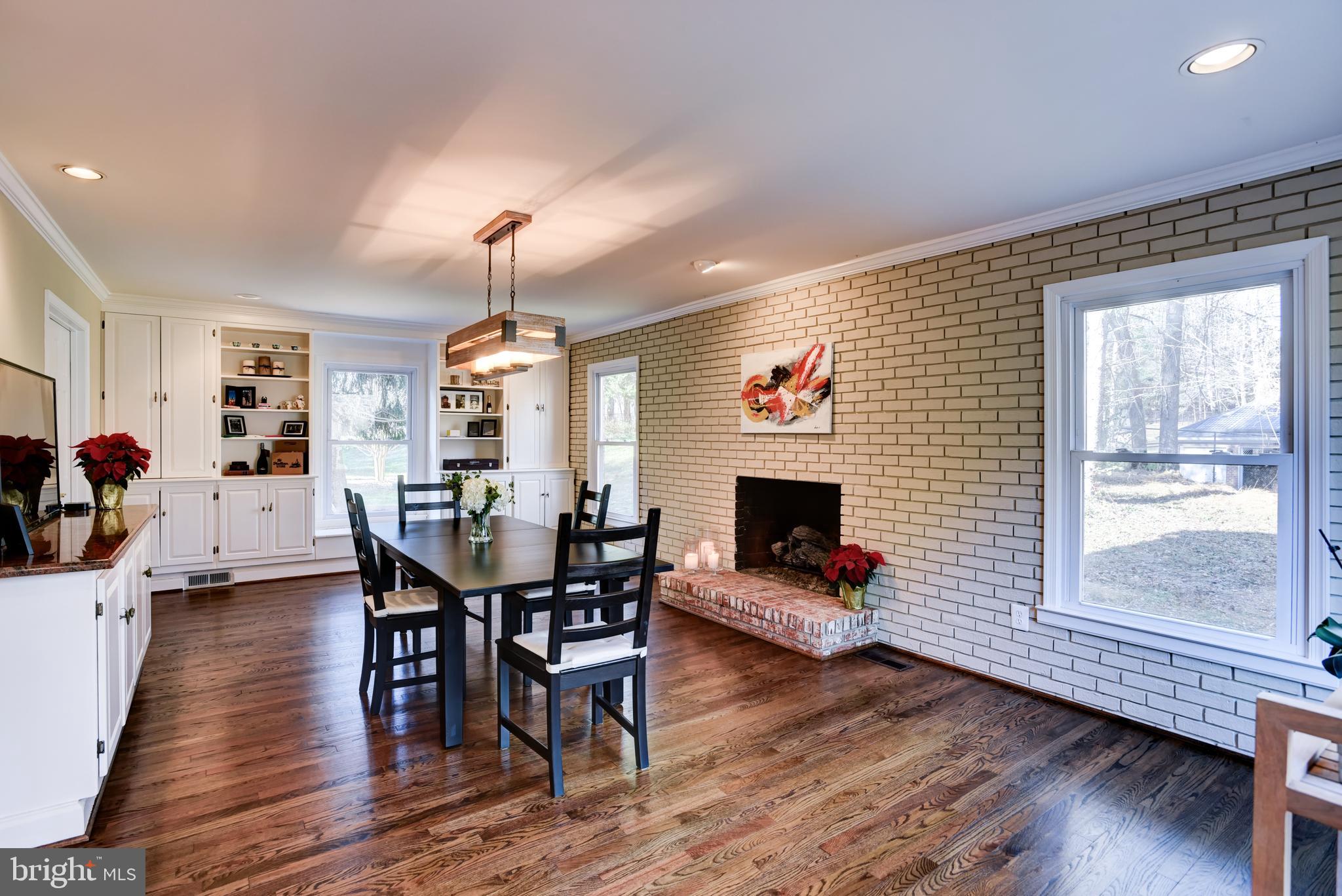 13629 Esworthy Road Germantown, MD 20874 - Photo 9 of 50 Family room with cabinetry and fireplace