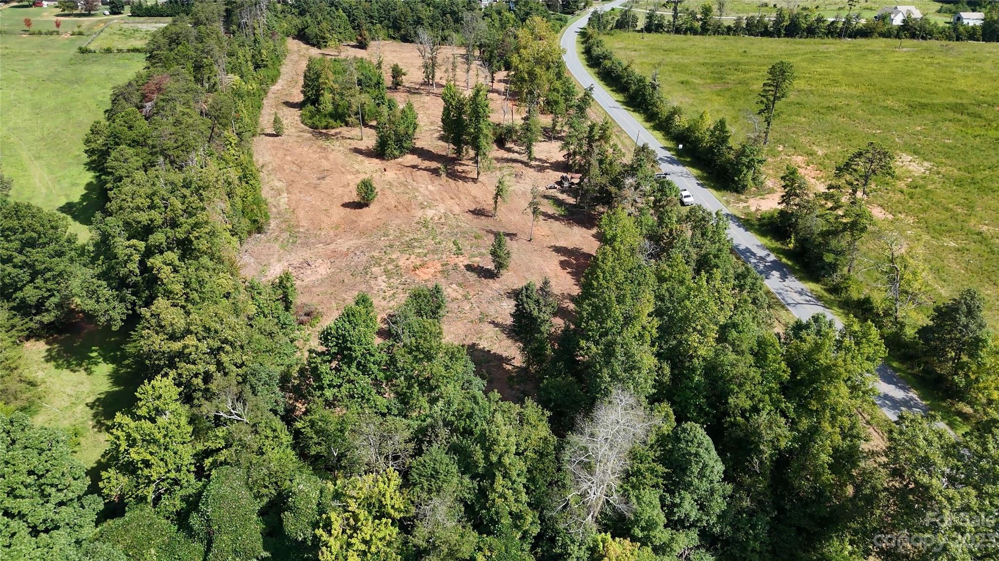 Lot 3 Poors Ford Road, Unit 3 Tryon, NC 28782 - Photo 6 of 34 an aerial view of residential house with outdoor space and trees all around