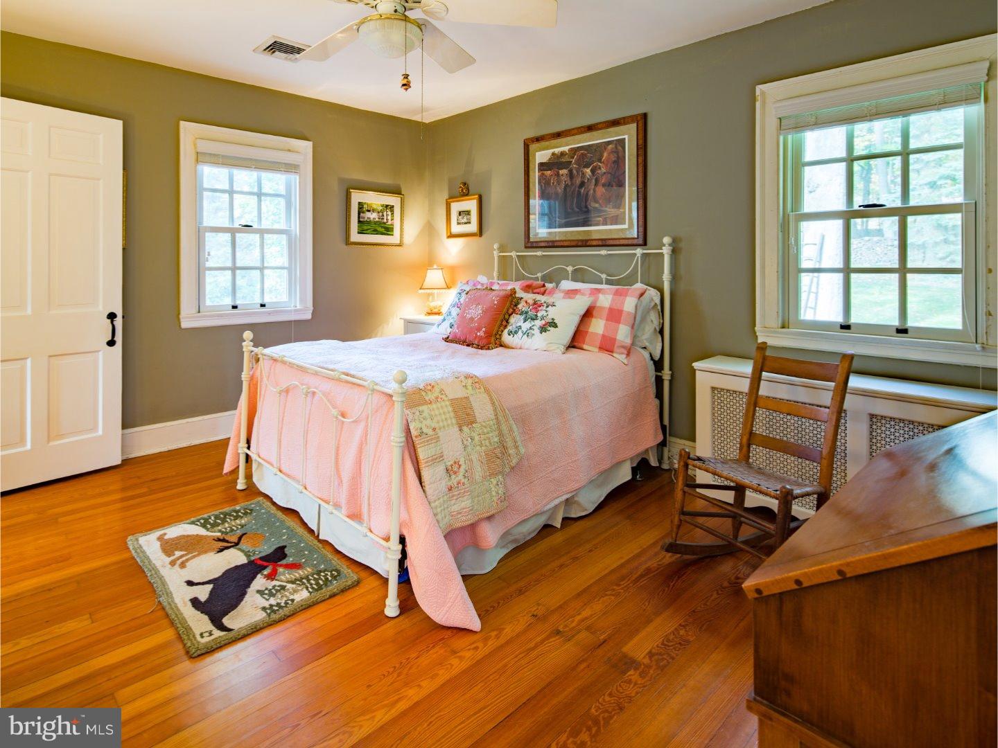 11 Forest Road Wayne, PA 19087 - Photo 22 of 25 a bedroom with a bed and wooden floor