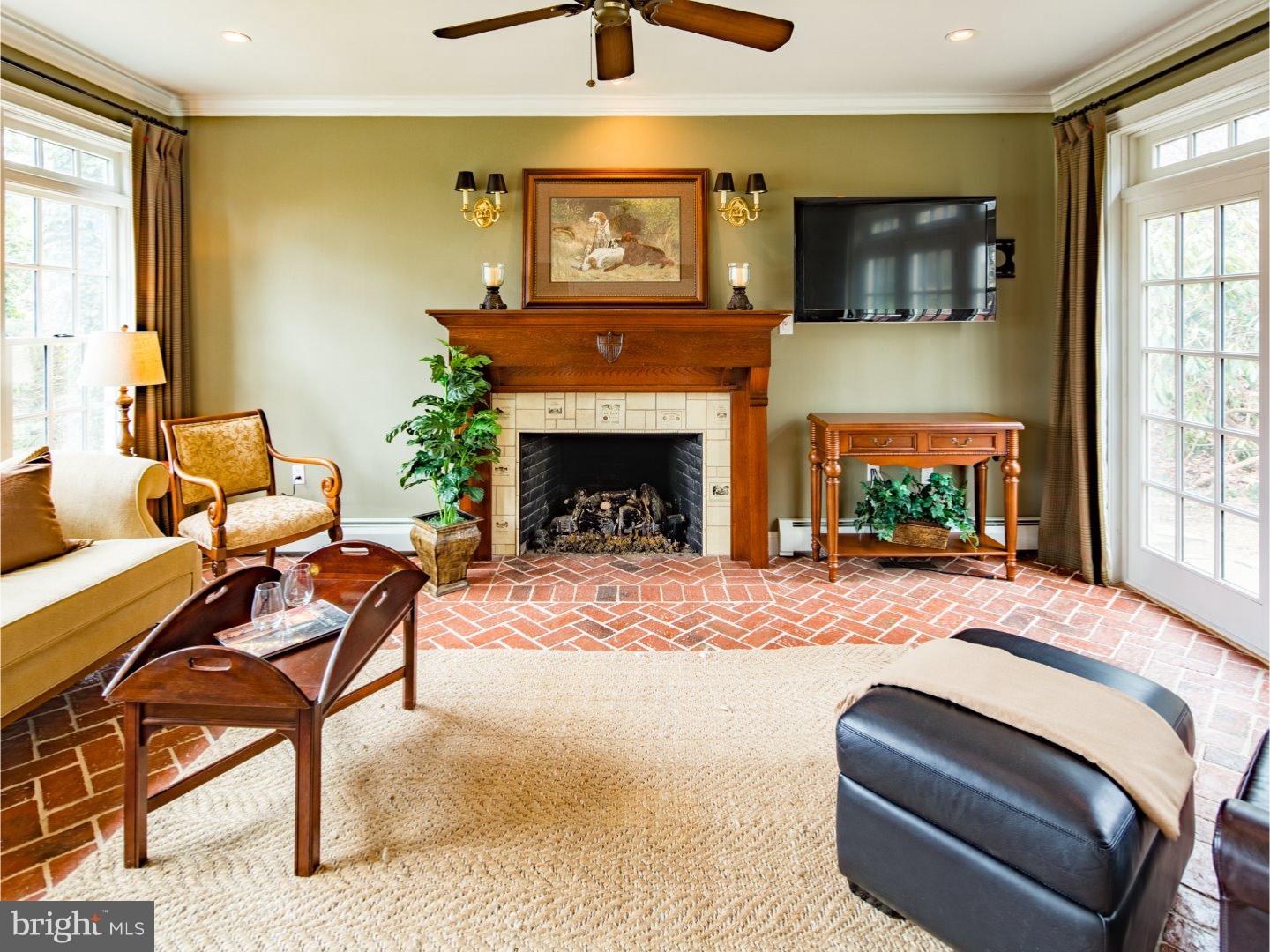 11 Forest Road Wayne, PA 19087 - Photo 6 of 25 a bedroom with furniture and a fireplace