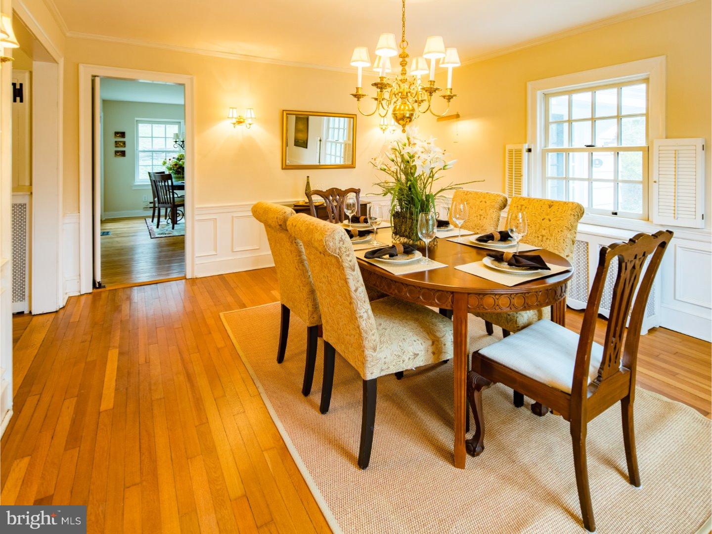 11 Forest Road Wayne, PA 19087 - Photo 8 of 25 a dining room with furniture and a chandelier