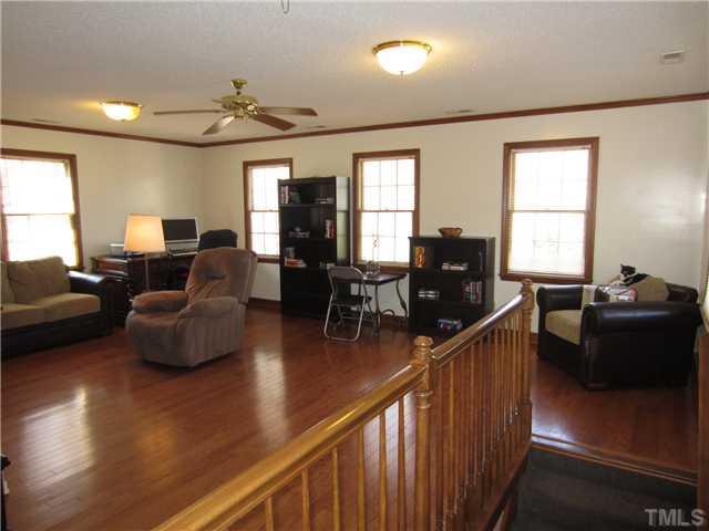 115 Brandywine Drive Raleigh, NC 27607 - Photo 19 of 25 a living room with furniture and wooden floor