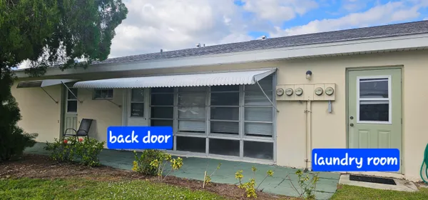 a view of a lake with a house in the background