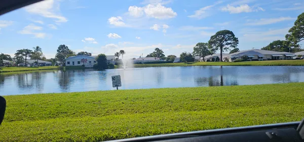a view of a swimming pool with a garden