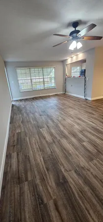 wooden floor in an empty room with a fireplace