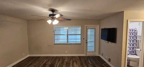 a view of an empty room with a window