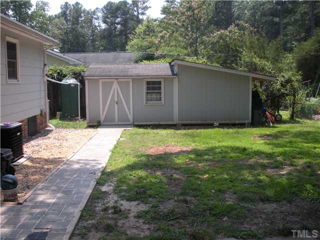 5822 Newhall Road Durham, NC 27713 - Photo 22 of 25 Backyard features a wired 10x20 storage shed, 300 Gallon Rain Barrel Collector, Fenced Backyard. Storage