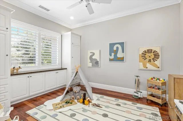a outdoor living space with furniture potted plant and a large window