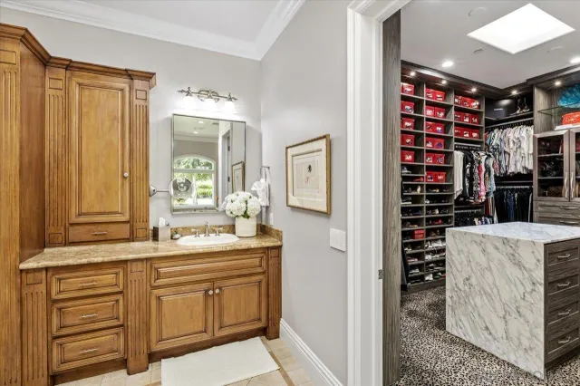 a reading room with furniture and a chandelier
