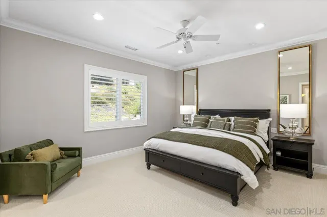 a bathroom with a granite countertop sink a mirror and a shower