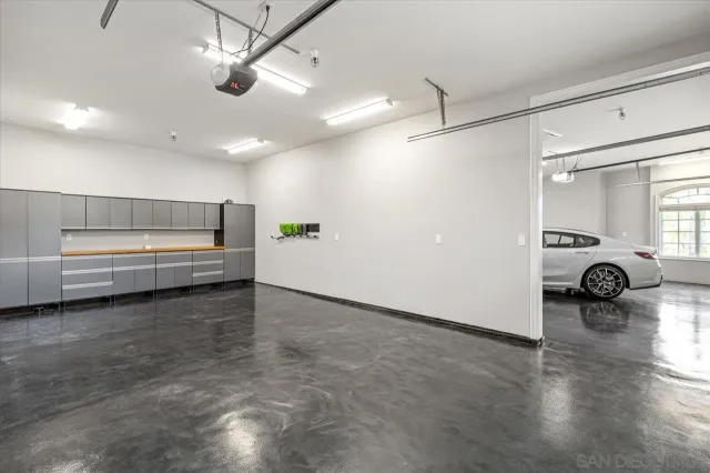 a kitchen with a sink and a mirror