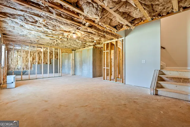 a view of an empty room with a fireplace