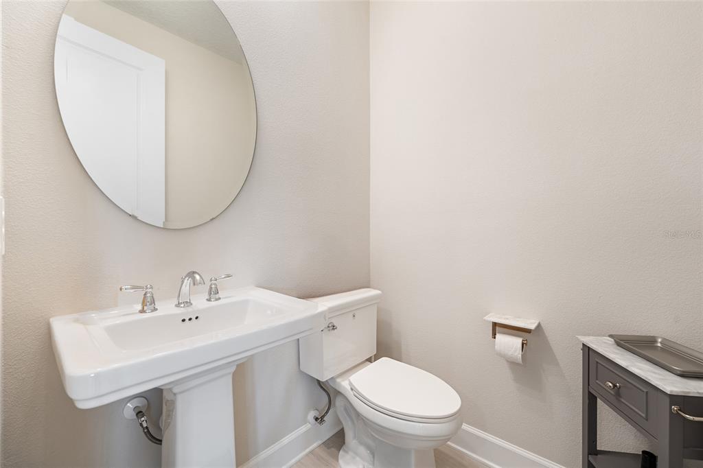 10175 Brocksport Circle Gotha, FL 34734 - Photo 37 of 54 a bathroom with a sink a toilet and a mirror