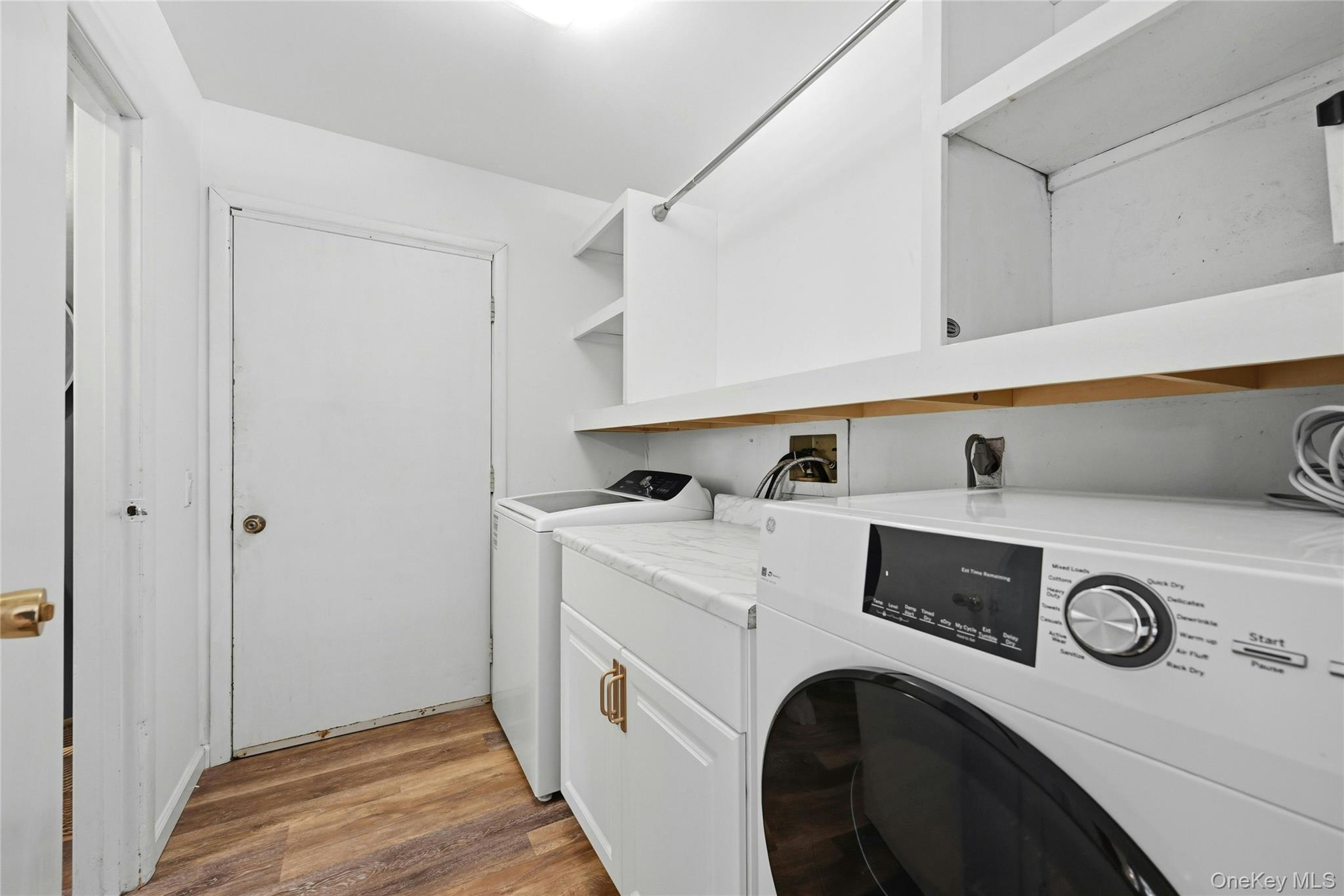 15 Birch Road Rocky Point, NY 11778 - Photo 11 of 30 Main floor Laundry Room, with storage and folding station